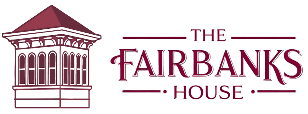 Logo of The Fairbanks House featuring a stylized architectural element and elegant typography.